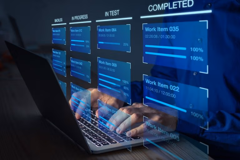 Agile software development with developer using Kanban board framework methodology on computer.