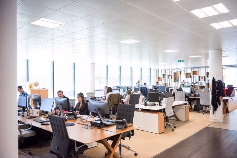 Salesforce implementation: office with team of workers sat at their desks